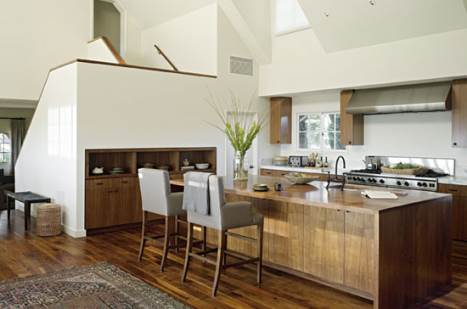 open kitchen with large wooden cooking island