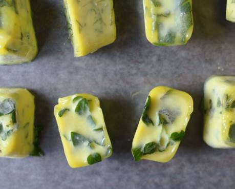 some frozen cubes of fresh herbs