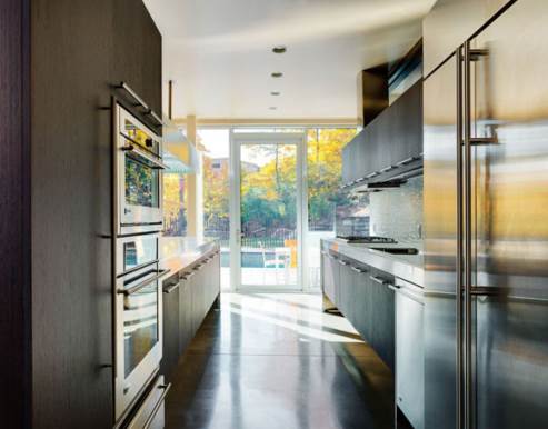 stainless steel countertops and custom wooden cabinets