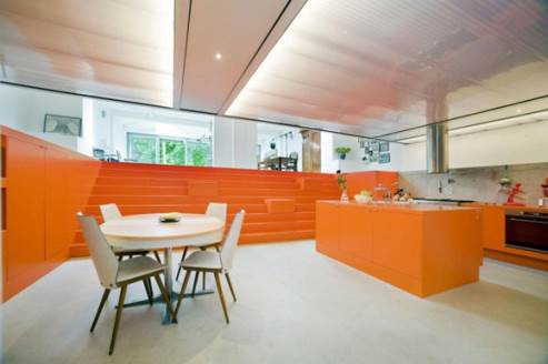 view from the kitchen to the orange stairs