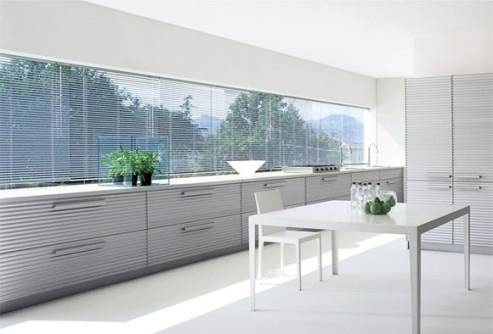 modern white kitchen by schiffini