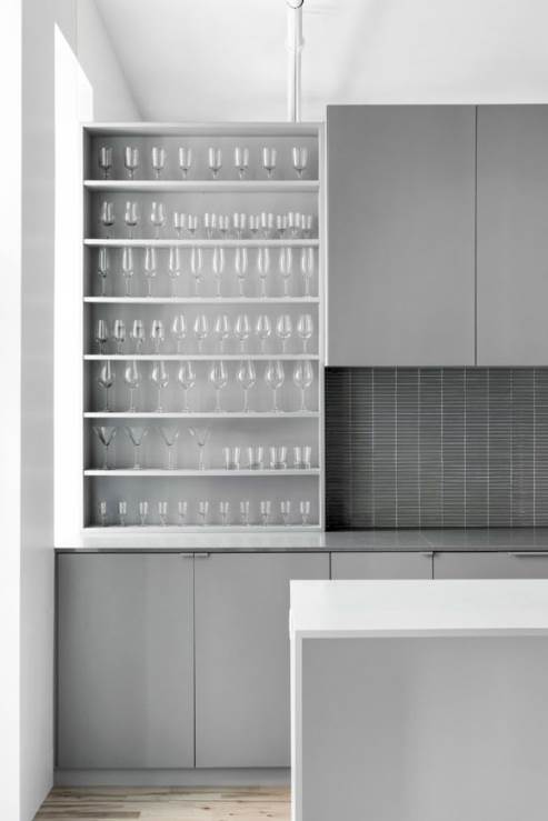 open drawers and dark tile kitchen backsplash