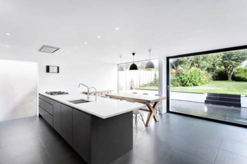 kitchen island with black cabinets and white countertop