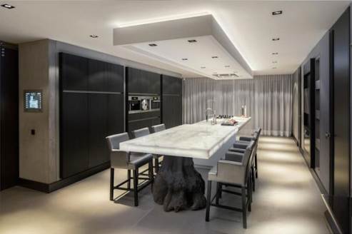 sleek dark kitchen by Kolenik